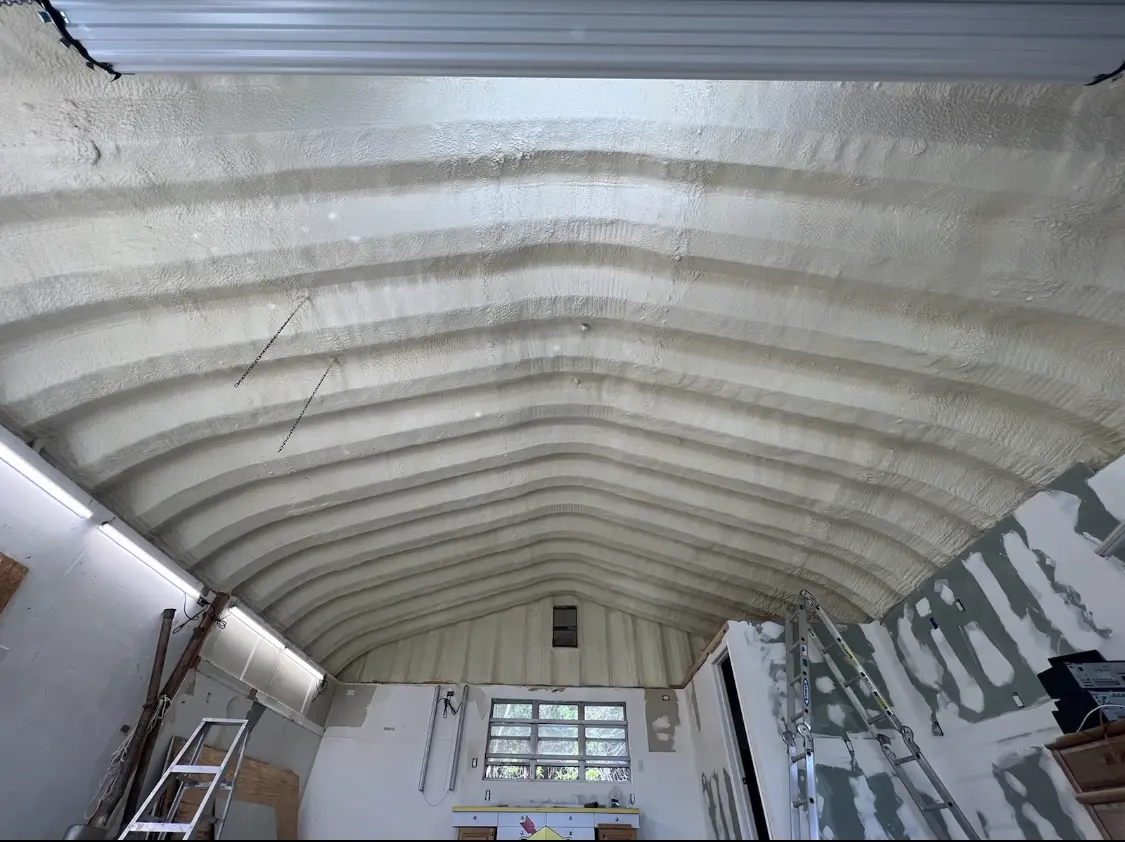 Spray polyurethane foam applied to the underside of a metal roof deck in Collinsville
